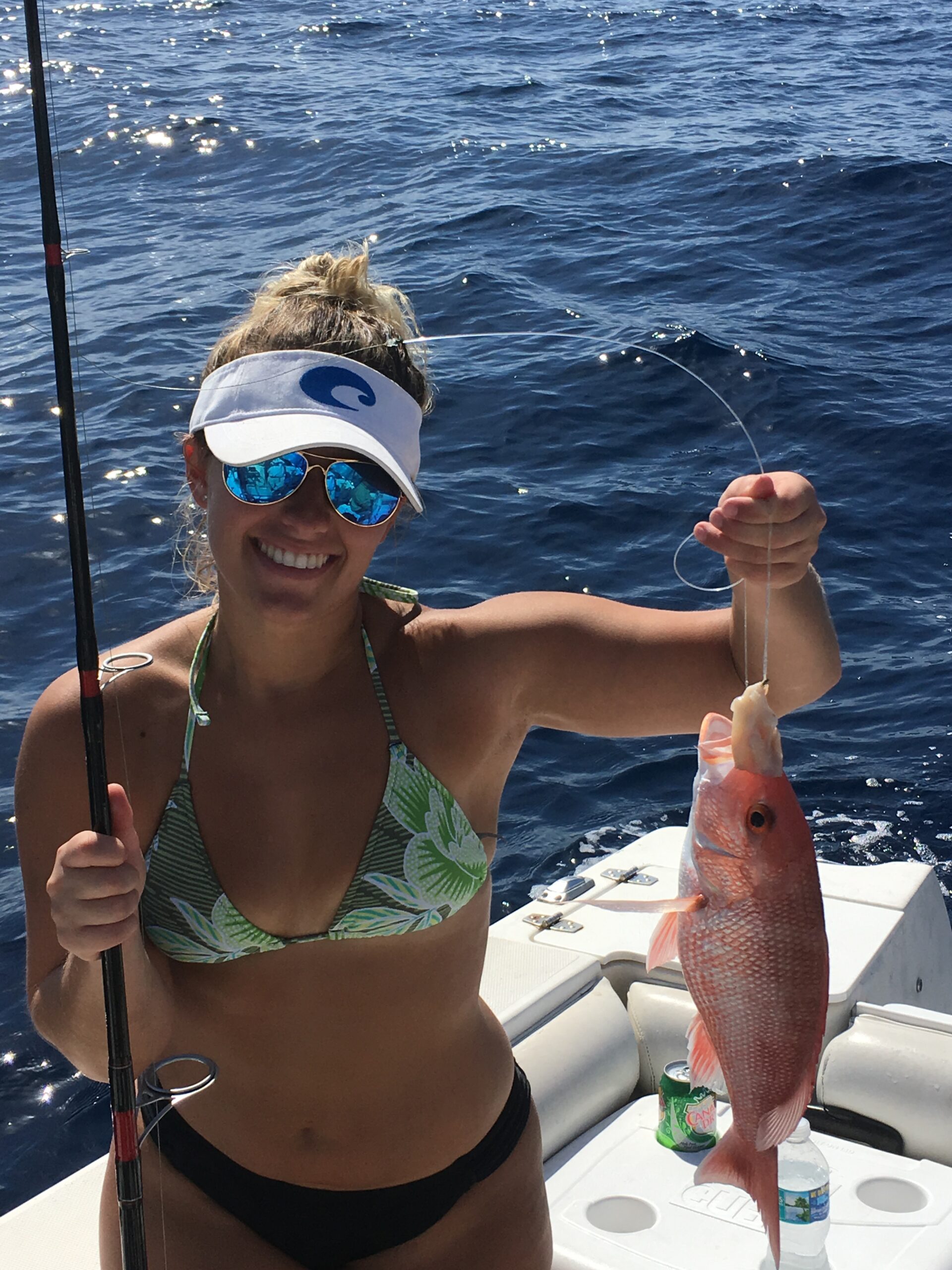 Amanda holding up a red snapper caught fishing off sarasota gulf waters