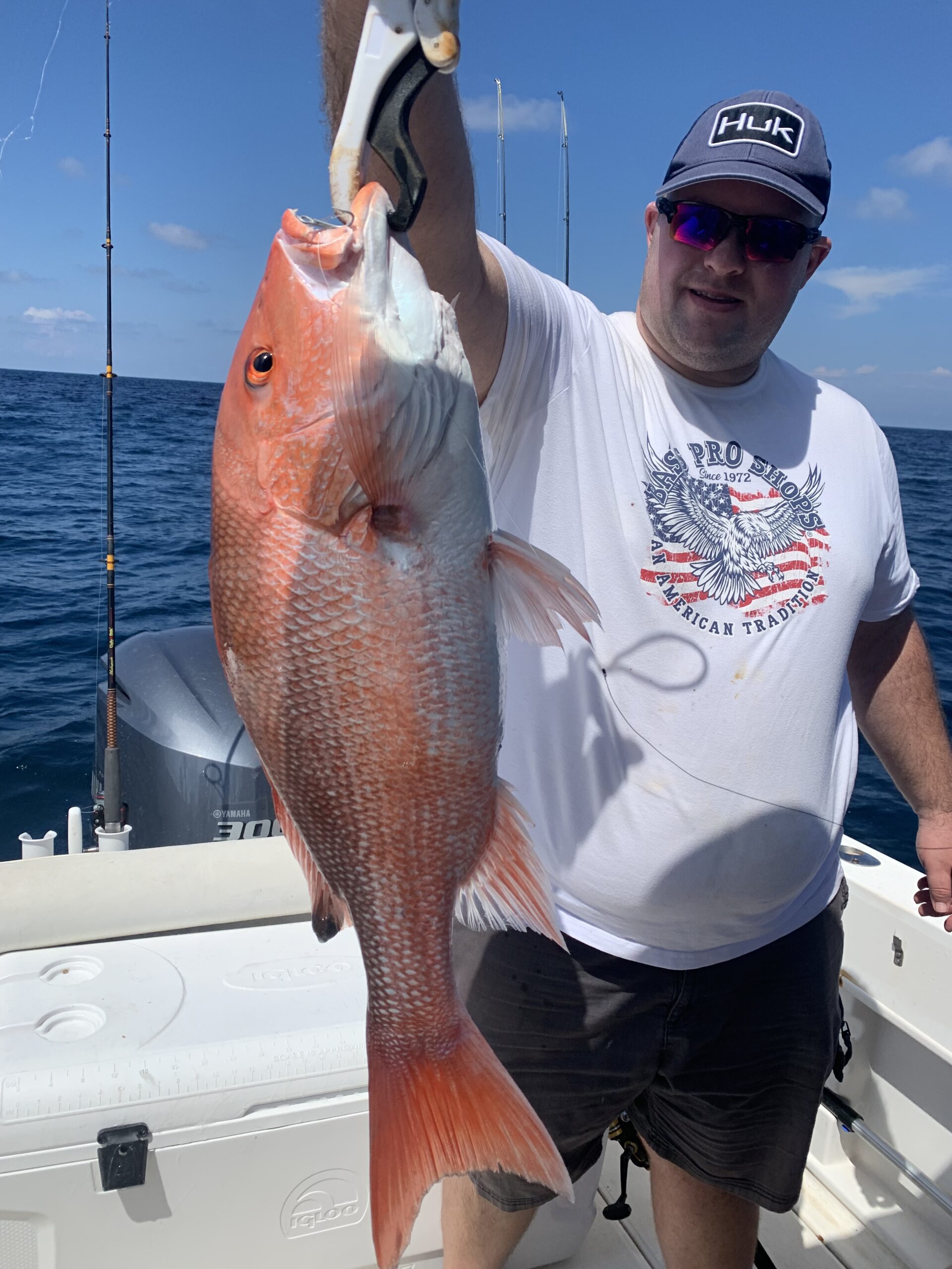 Jon holding up a red snapper caught off sarasota gulf waters